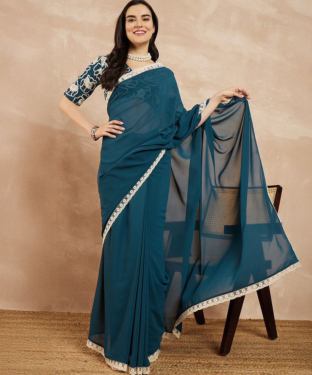 Eleganz in Petrol georgette Saree
