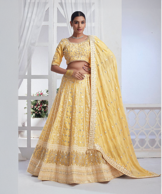 Yellow soft net lehenga with silver embroidery