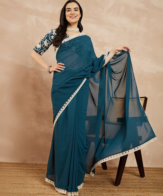 Eleganz in Petrol georgette Saree