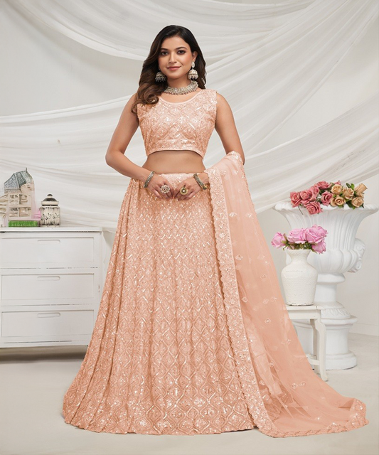 Peach colored lehenga made of soft net